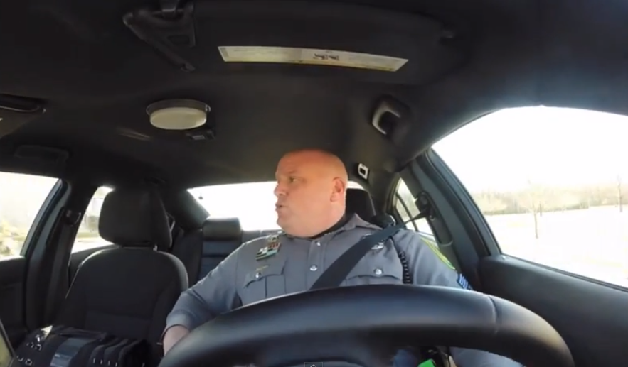 Police officer shakes it off to Taylor Swift while cruising.